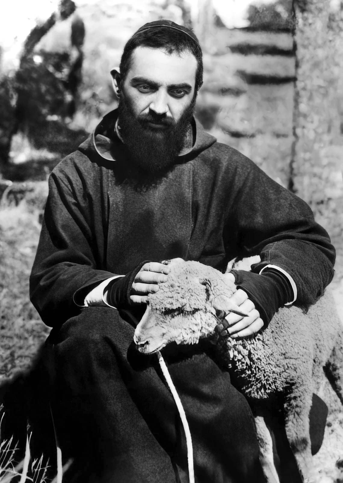 Padre Pio as a young Capuchin friar, holding a lamb — photographer unknown, 1920s