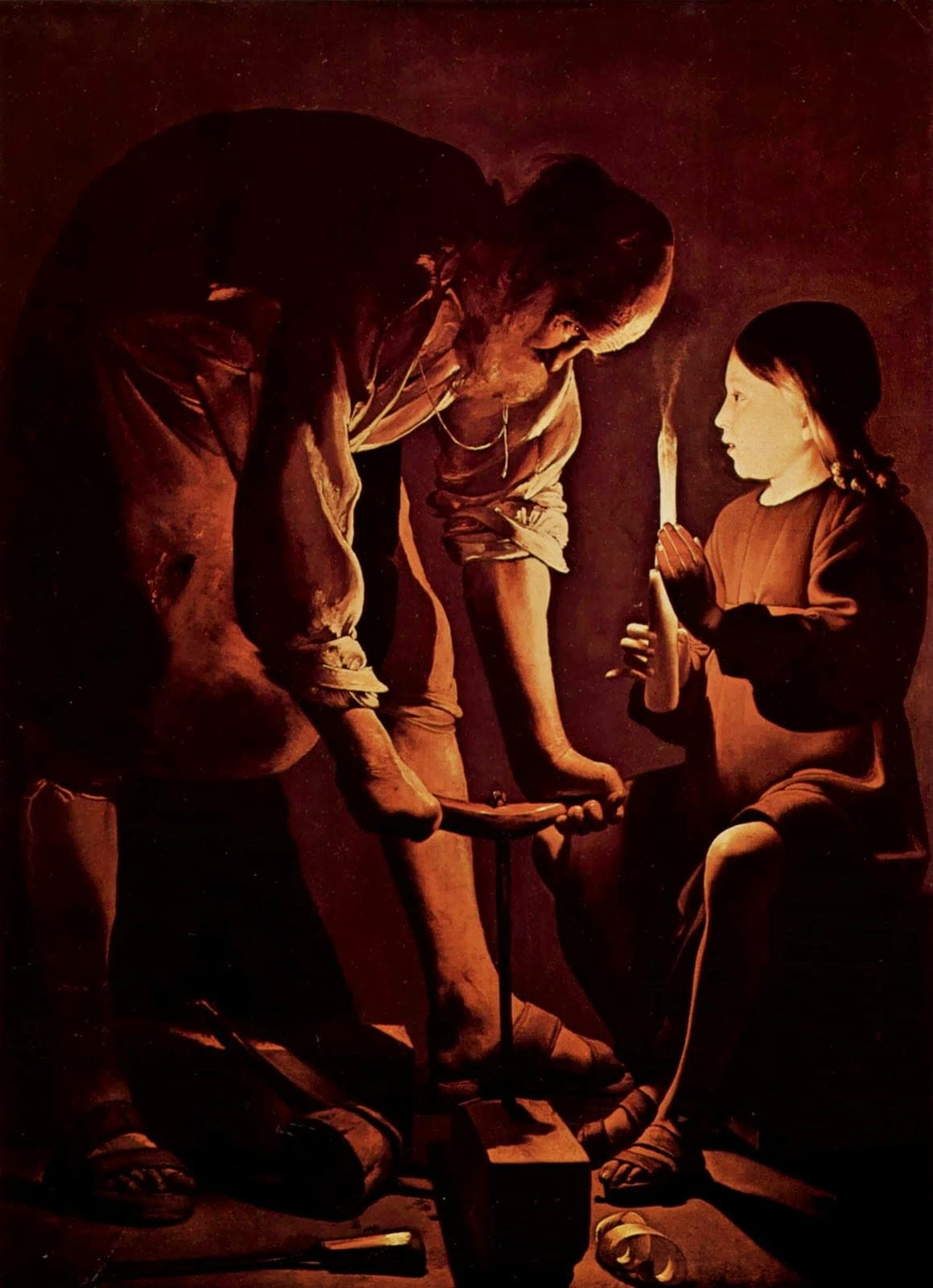 St. Joseph at work in his carpenter's shop, the boy Jesus holding a candle